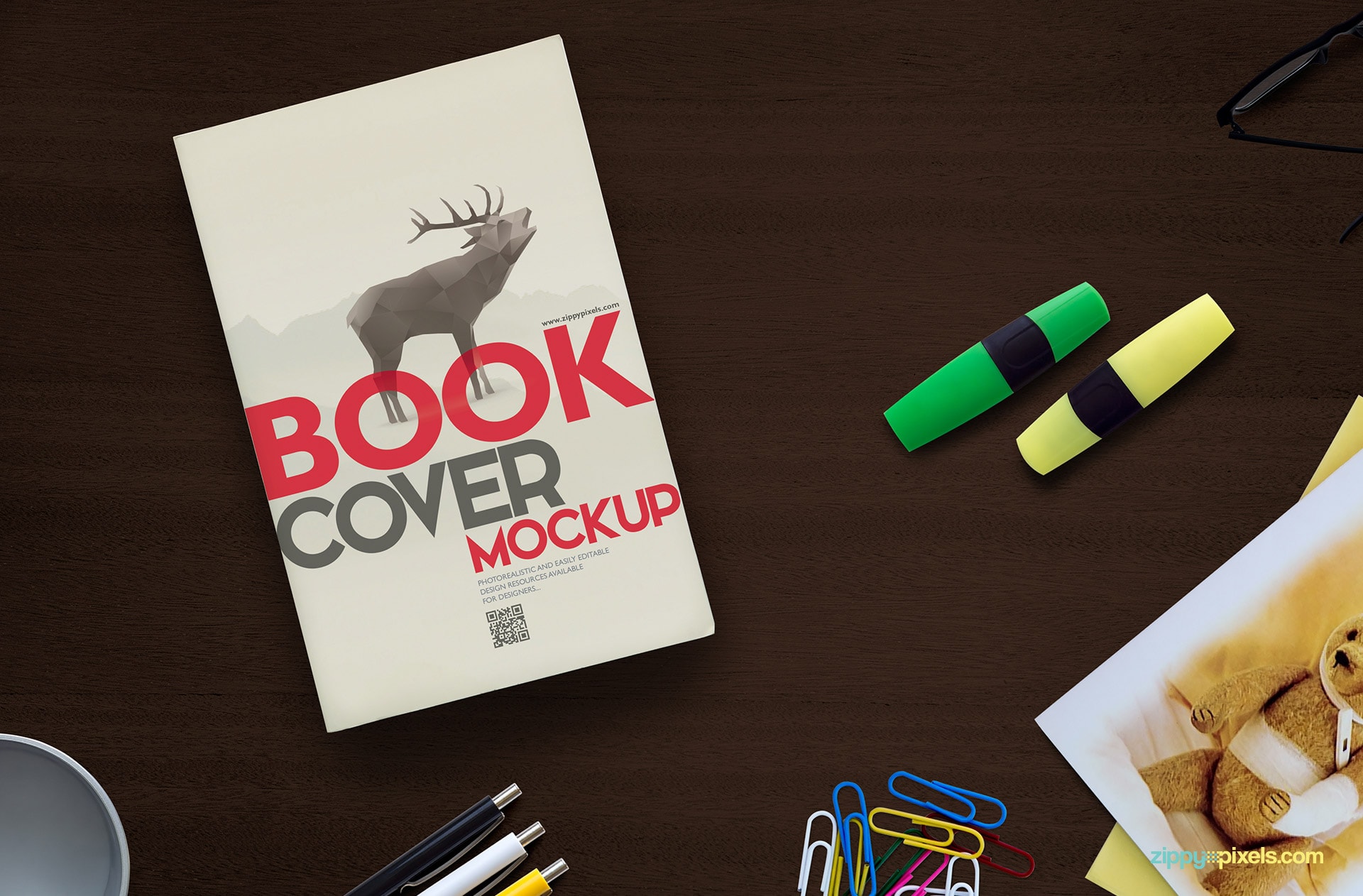 Book cover mockup psd with a pair of highlighters, bunch of paperclips, three pens, pen holder & greeting card