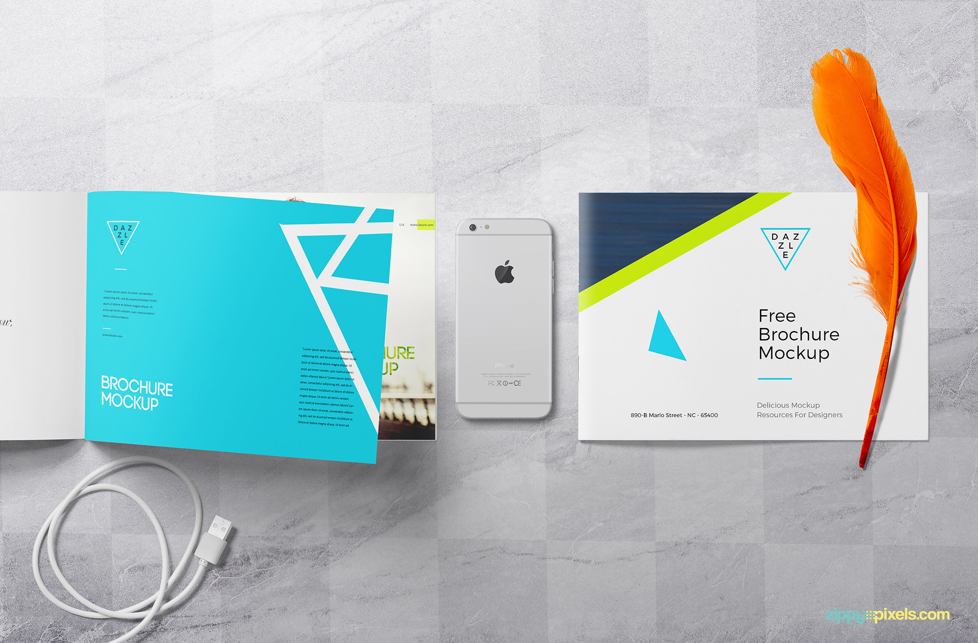 Free brochure mockup scene with iPhone, feather and data cable.