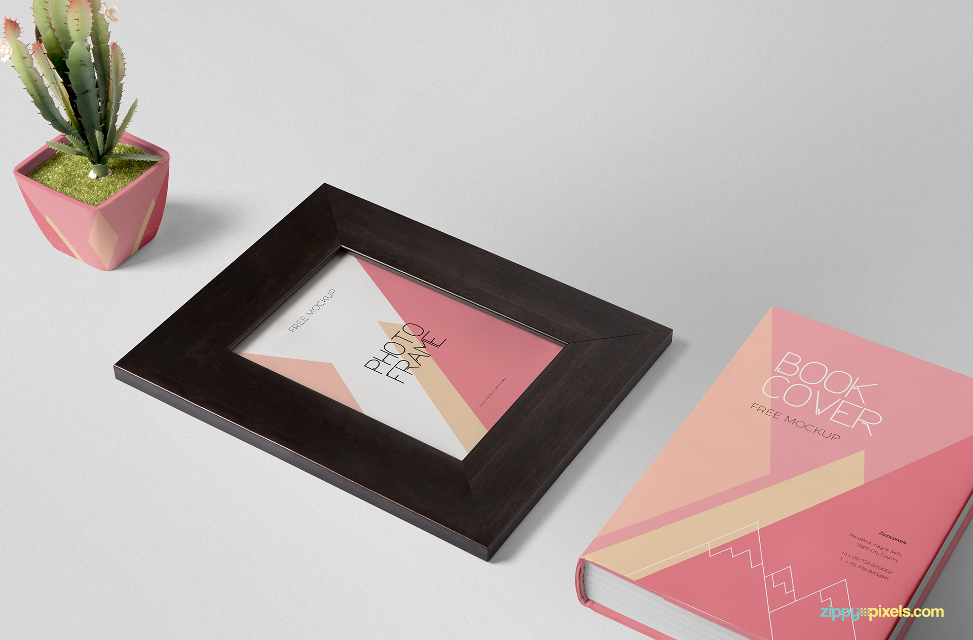 Frame mockup PSD scene including a picture frame, plant pot and book cover.