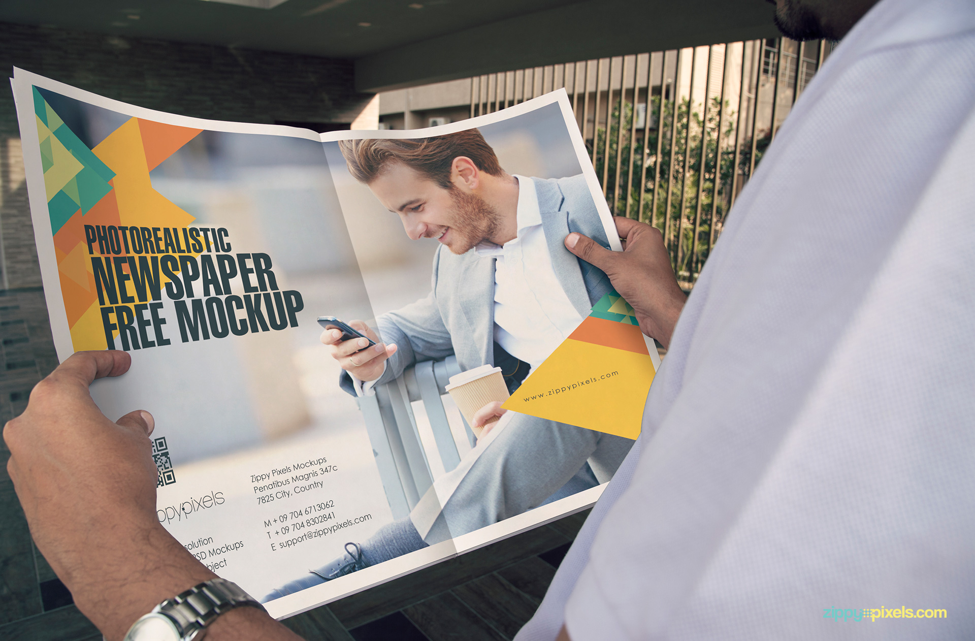 A man holding a newspaper ad design mockup.