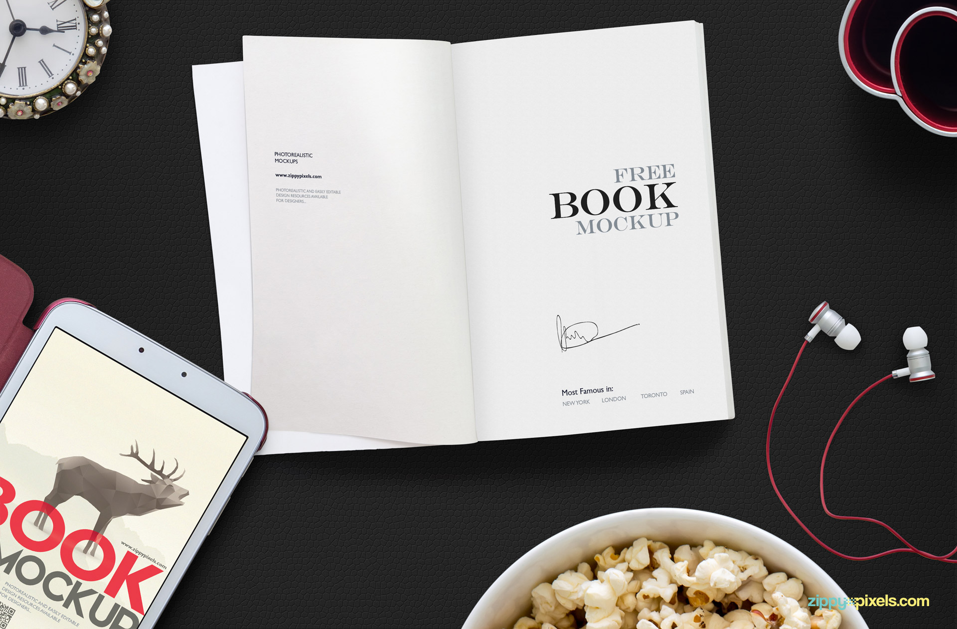 An open book mockup scene along with tablet, popcorn bowl, hands-free, clock and pen holder.