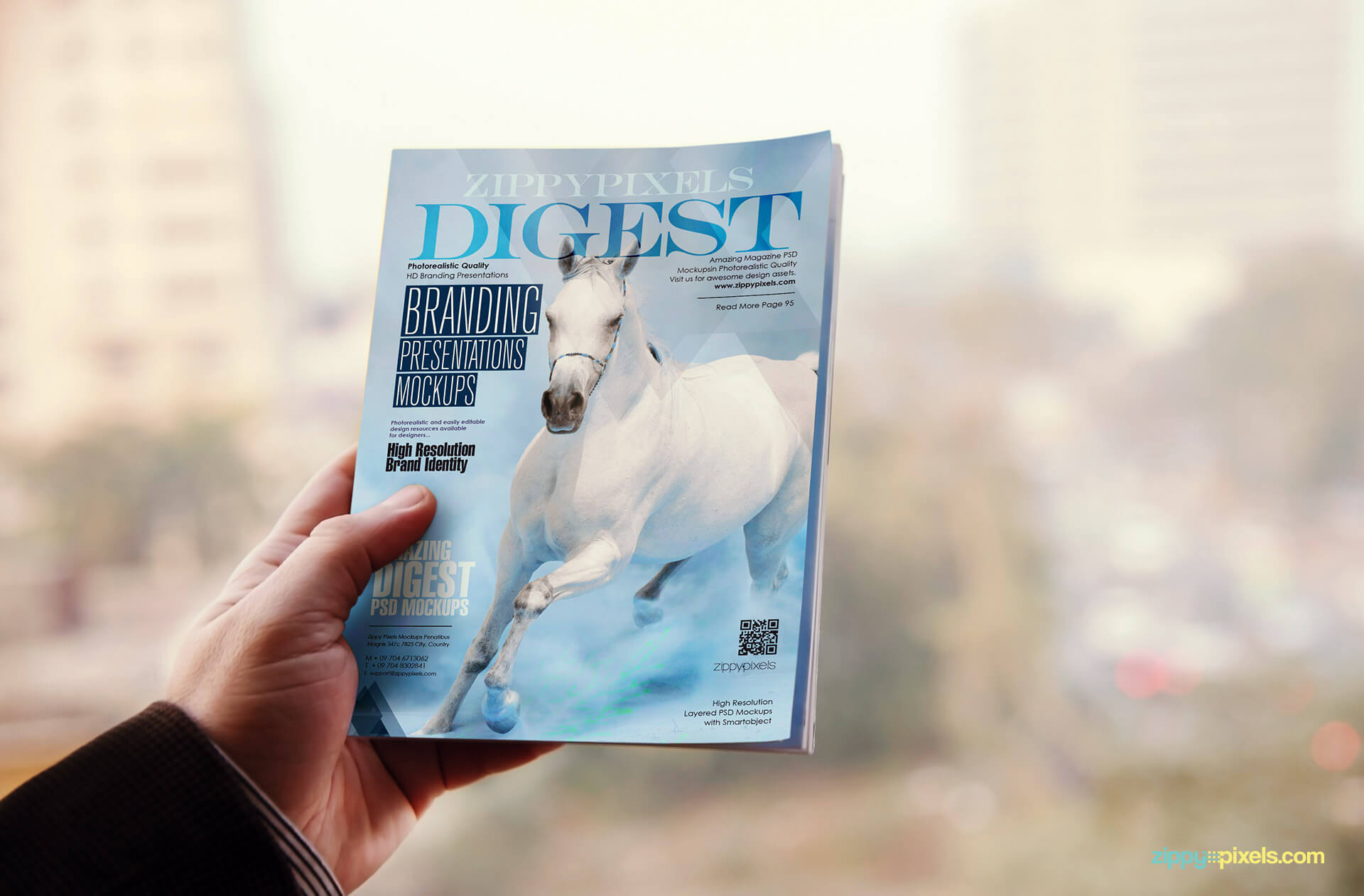 PSD magazine mockup of digest held in one hand showing front cover