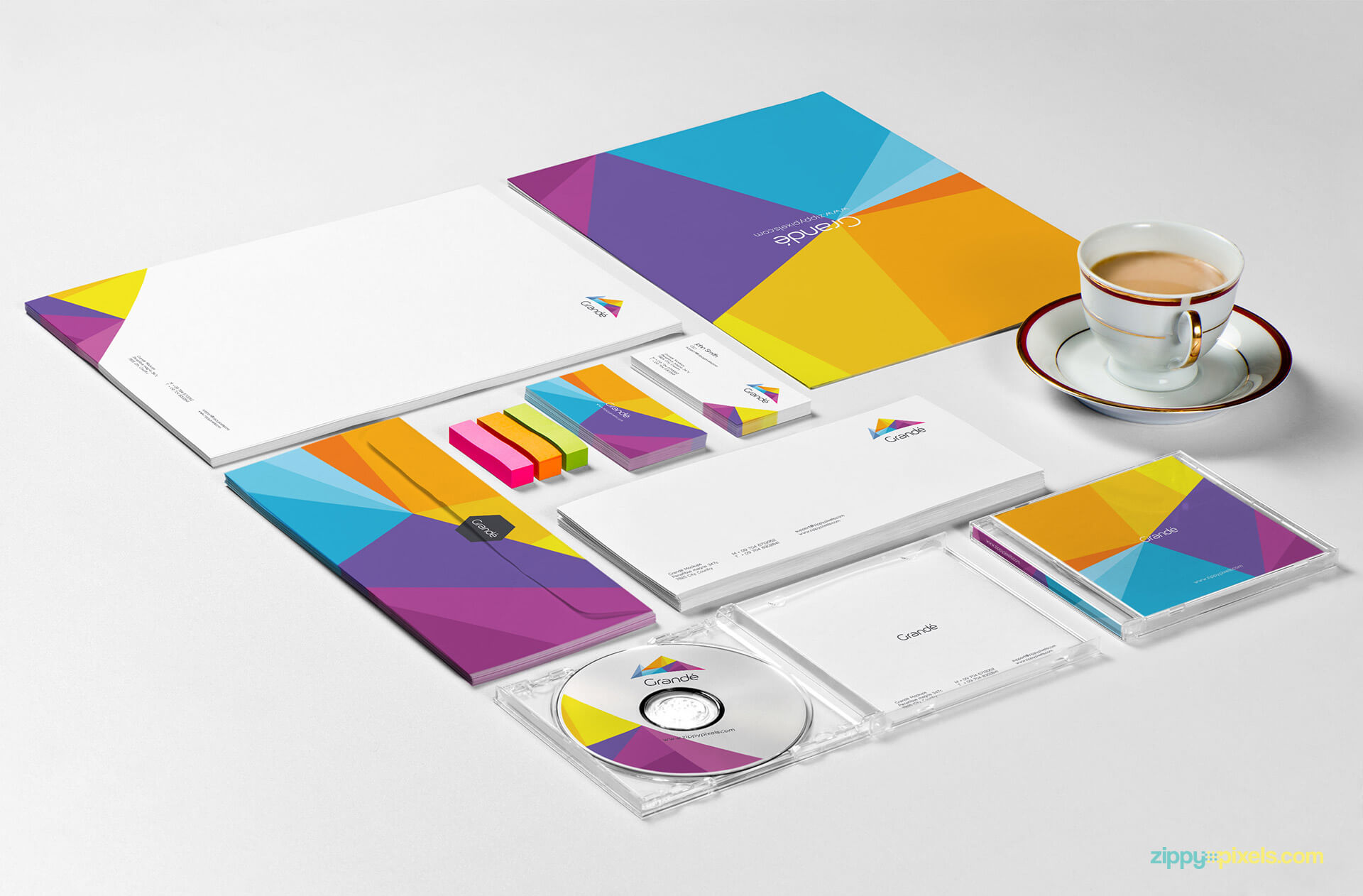 Comprehensive Stationery Branding Mockup of File Folder, Letterhead, Envelope, Business Cards & CD Cover with Tea Cup & Erasers